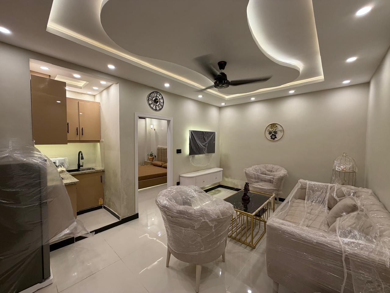 Fully furnished living room of 1 bedroom apartment near Doctor Hospital Lahore
