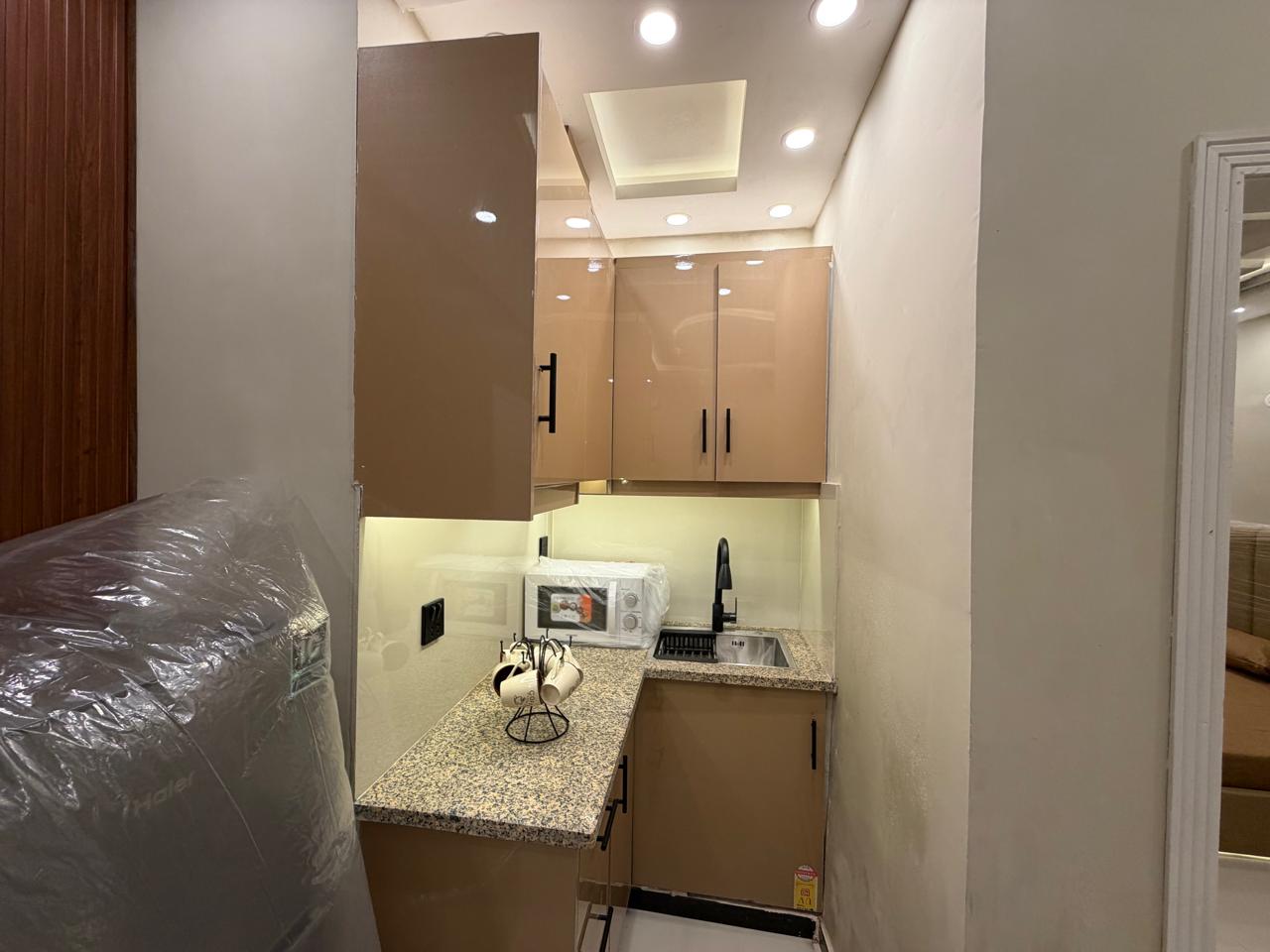 Kitchen of fully furnished 1 bedroom apartment in Lahore